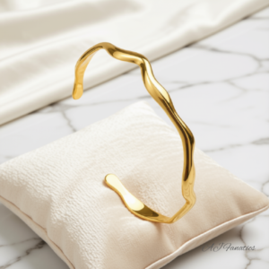 Free-Spirited Bangle Bracelet in gold-plated stainless steel, featuring an open, wavy silhouette with modern minimalist style.