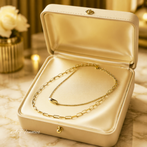 Link of Sleekness Pendant Necklace in gold-plated stainless steel with dual chain layers displayed in a jewellery box.