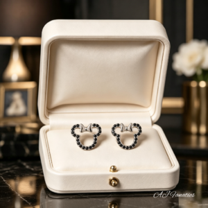Dainty Noir—Beary Small Bowtie Stud Earrings in polished 925 silver, outlined in black gems with a silver bowtie, shaped as petite bear silhouettes displayed in a gift box.