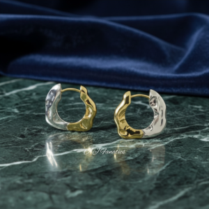 Molten Orbit 925 Silver Gold 925 Silver Hoop Earrings with organic molten texture and two-tone design, displayed on green marble with deep navy velvet backdrop.