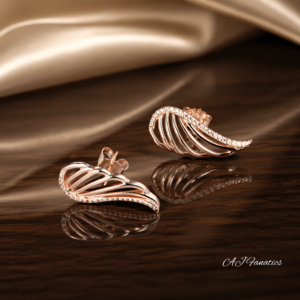 The Winged Adorners Statement Earrings featuring sculpted rose gold wing-shaped studs with openwork design and sparkling champagne gem accents.